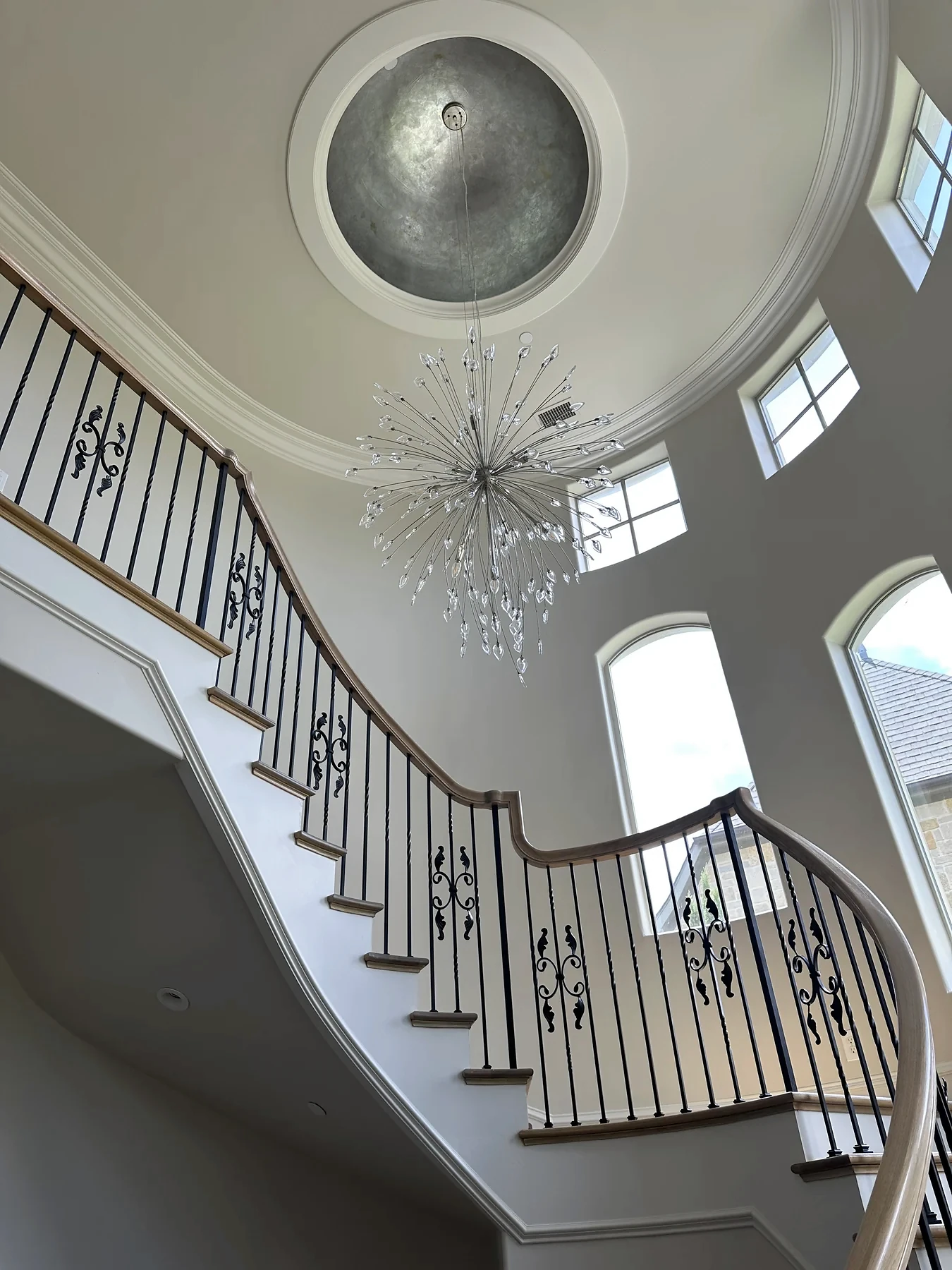 Curved staircase & ceiling detail from the HT Contractors project gallery